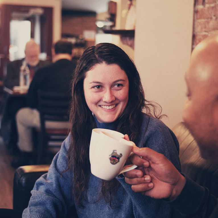 Person Smiling; coffee cup