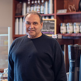 Restaurant owner, smiling